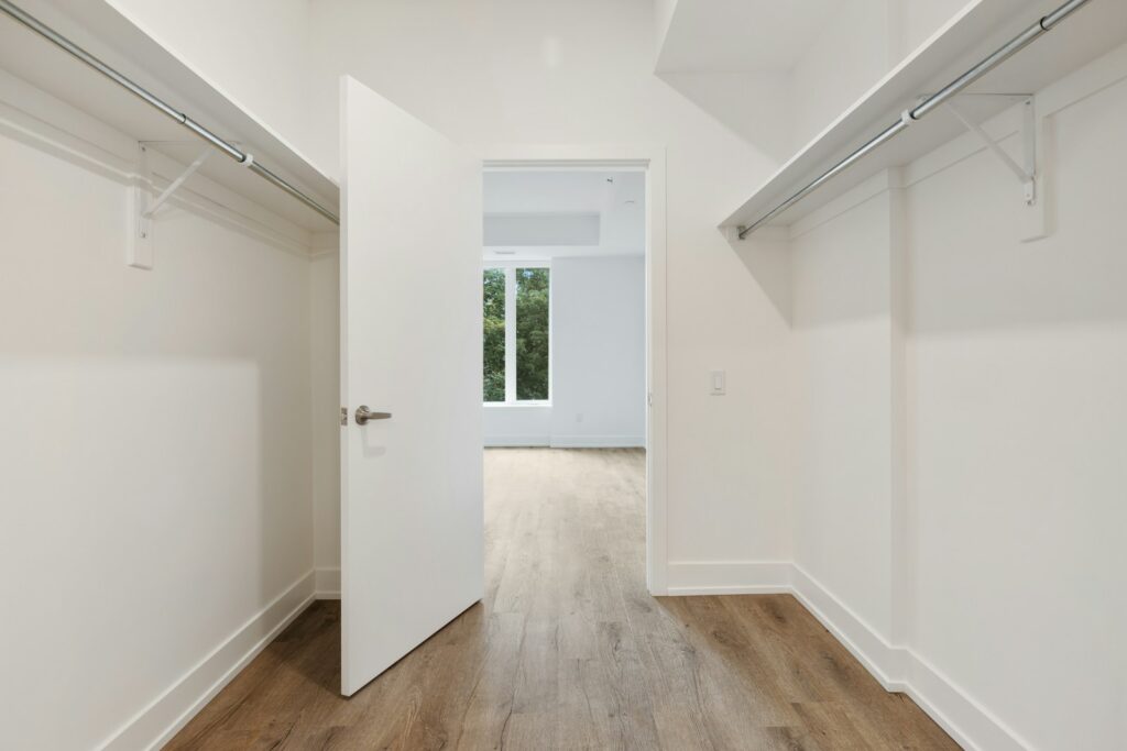 white wooden door on white painted wall