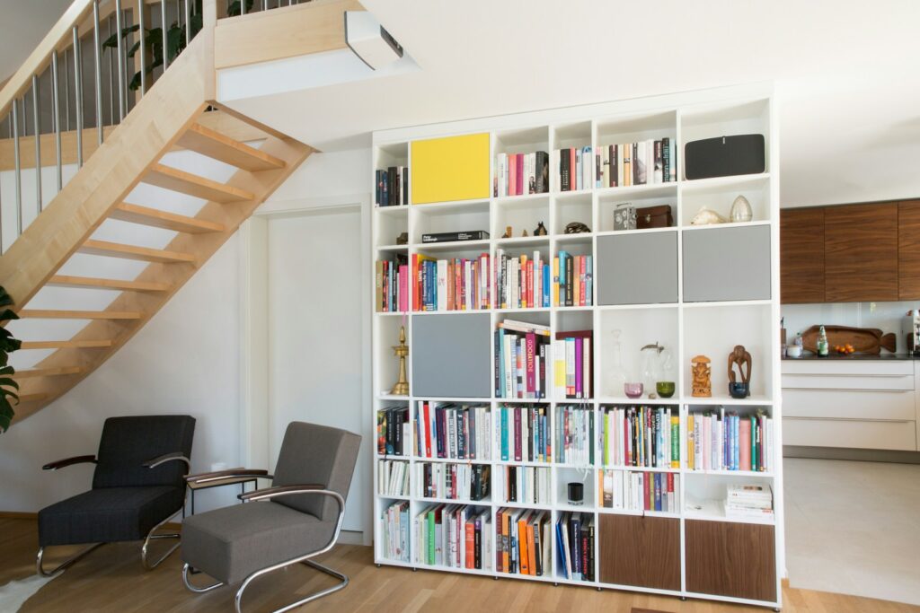 white wooden shelf with books