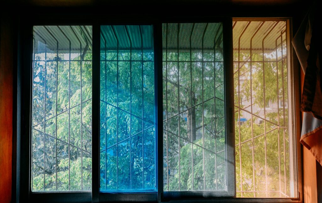 a window with a view of trees